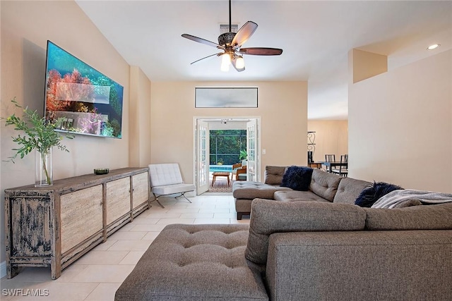 living room featuring ceiling fan and light tile patterned floors