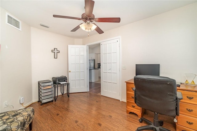 office space with ceiling fan, wood-type flooring, and french doors