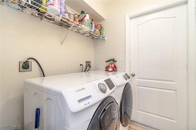 laundry room featuring washing machine and dryer