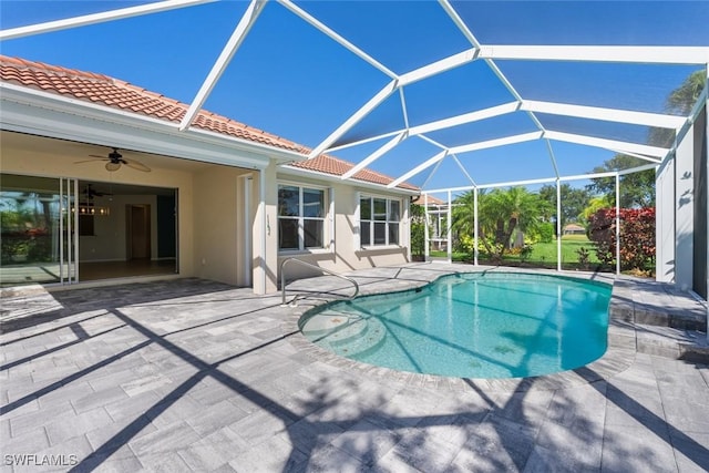 view of swimming pool featuring a lanai, ceiling fan, and a patio area