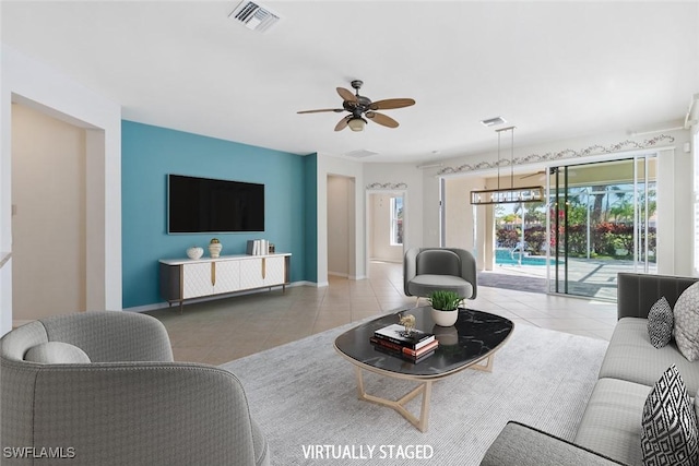 tiled living room with ceiling fan