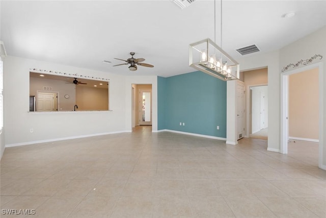 tiled empty room featuring ceiling fan