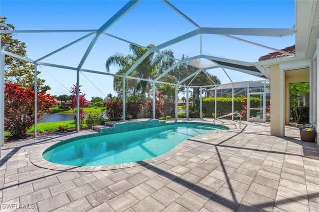 view of swimming pool with a lanai, a water view, and a patio