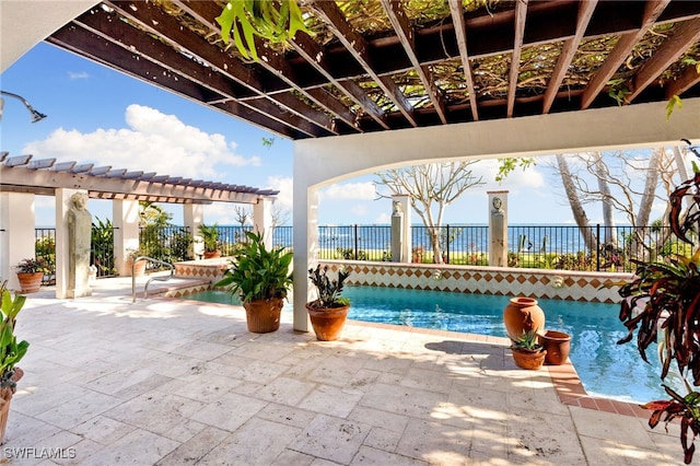 view of pool featuring a patio and a hot tub