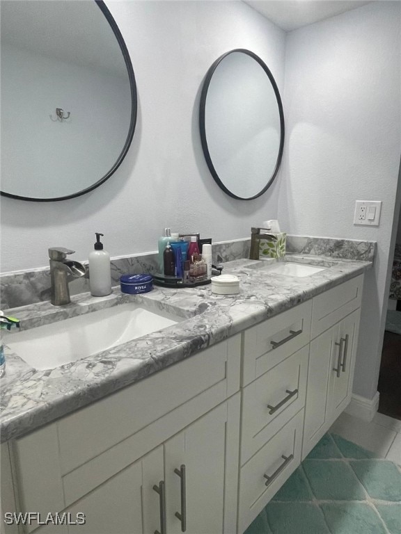 bathroom with tile patterned floors and vanity