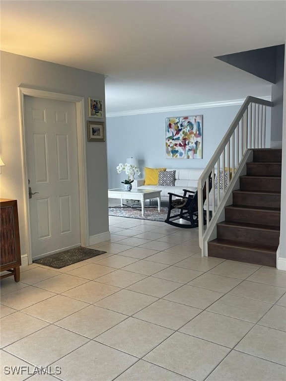 staircase featuring tile patterned floors and crown molding