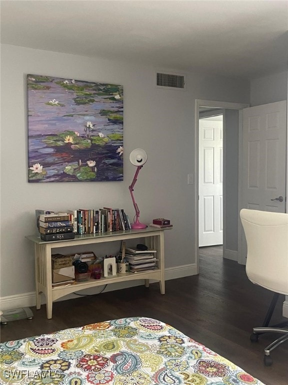 bedroom featuring dark hardwood / wood-style flooring