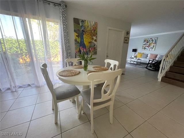 dining space featuring light tile patterned flooring