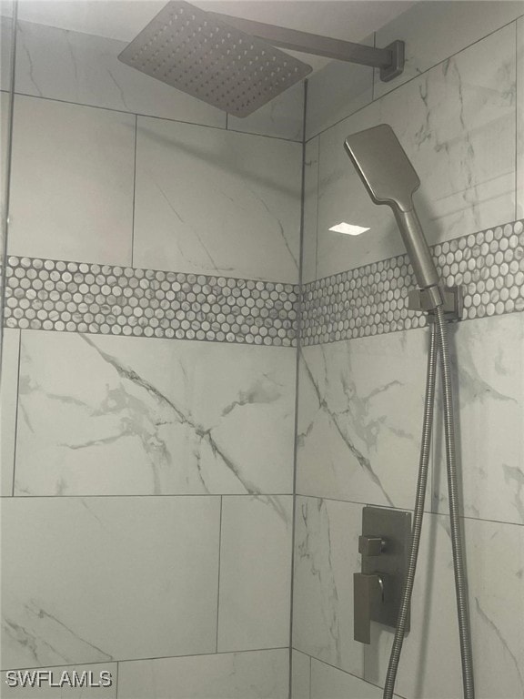 details featuring tiled shower