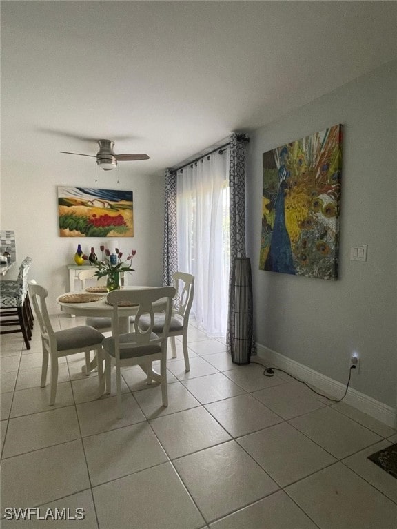 tiled dining room with ceiling fan