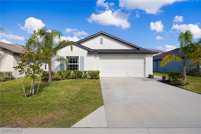 ranch-style house featuring a front yard and a garage