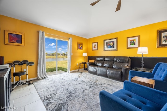 living room featuring ceiling fan and light tile patterned flooring