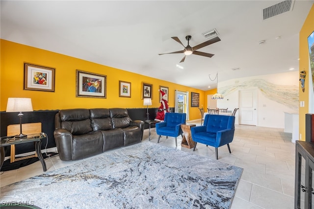 tiled living room featuring ceiling fan