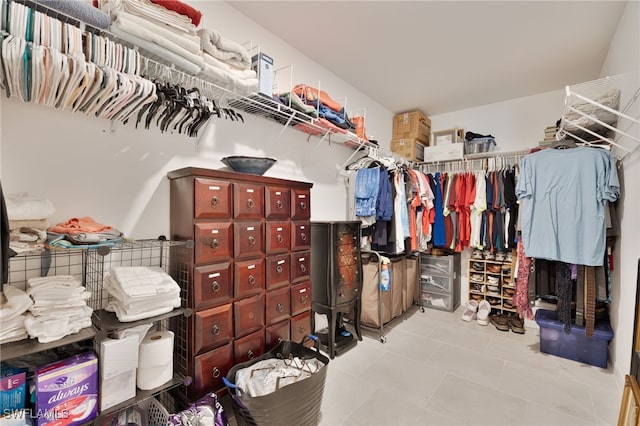 spacious closet with light tile patterned flooring