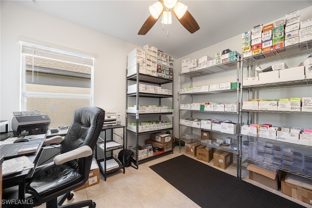 tiled office featuring ceiling fan