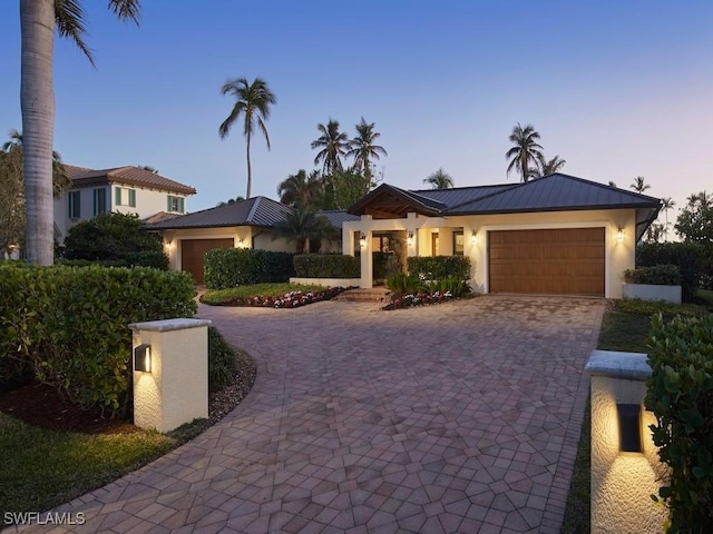 view of front of home with a garage