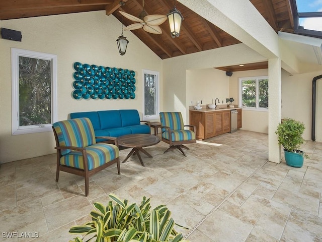 view of patio featuring exterior kitchen, outdoor lounge area, and ceiling fan