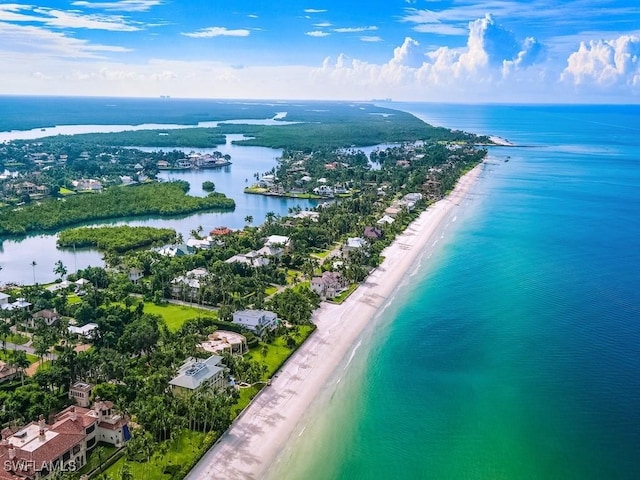 birds eye view of property featuring a view of the beach and a water view