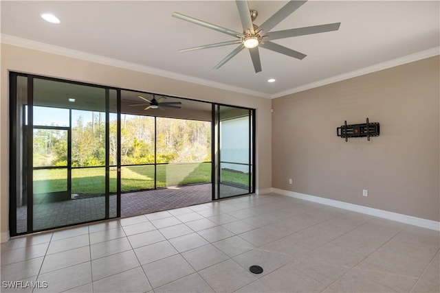 tiled empty room with ceiling fan and crown molding