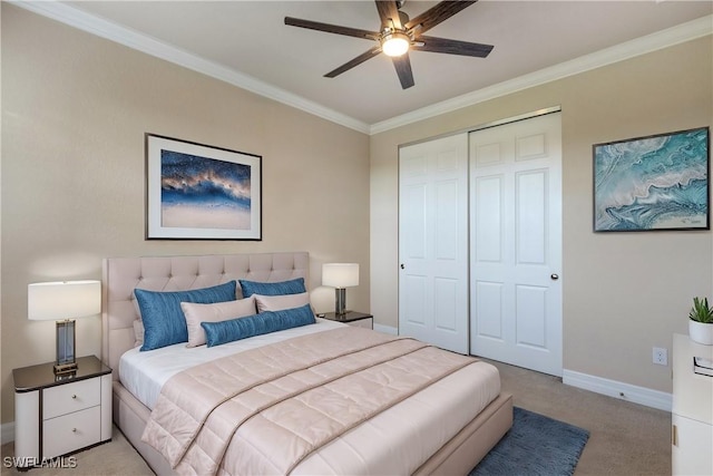 carpeted bedroom featuring a closet, ceiling fan, and crown molding