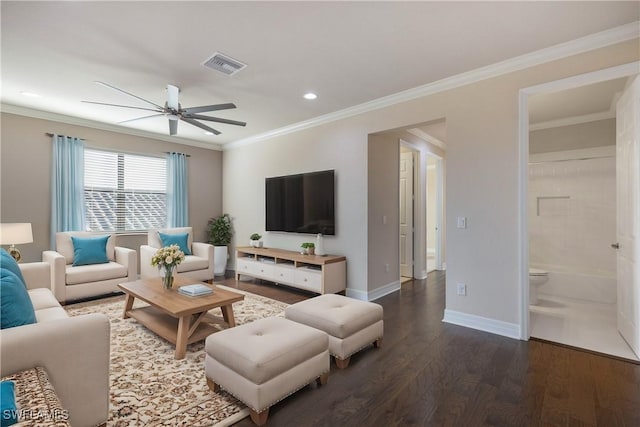 living room with dark hardwood / wood-style floors, ceiling fan, and crown molding