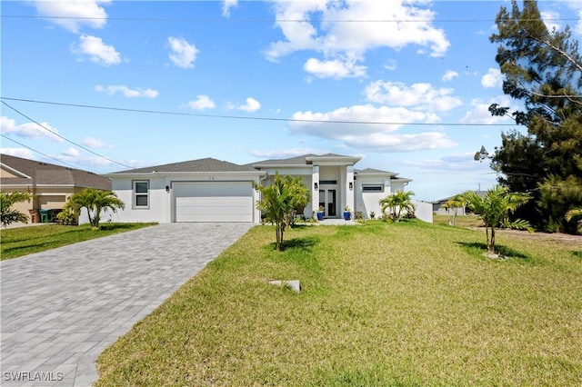 view of front of house featuring a front yard and a garage