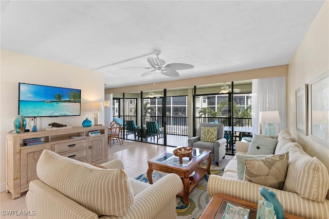 living room with ceiling fan and light tile patterned floors