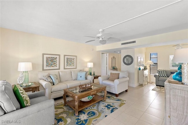 living room with ceiling fan and light tile patterned floors