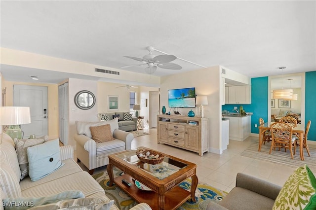 tiled living room featuring ceiling fan