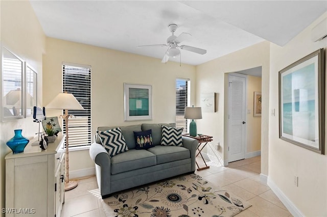 living room with light tile patterned floors, ceiling fan, and a healthy amount of sunlight