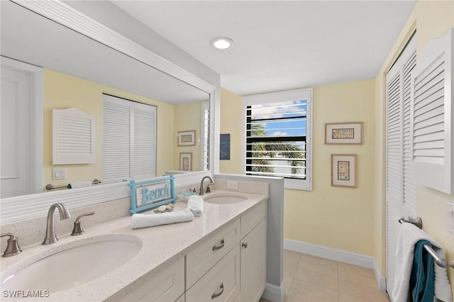 bathroom with tile patterned flooring and vanity