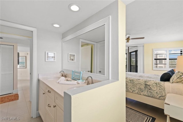 bathroom featuring tile patterned floors, ceiling fan, and vanity