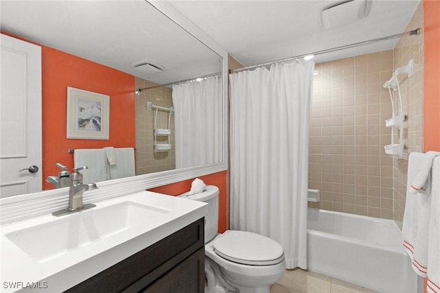 full bathroom with tile patterned floors, vanity, shower / tub combo, and toilet