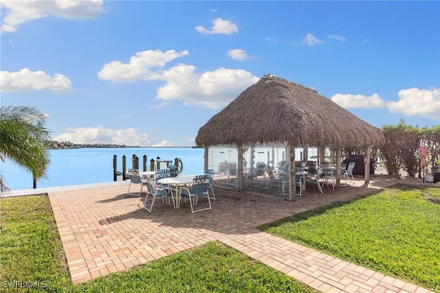 exterior space featuring a gazebo and a water view