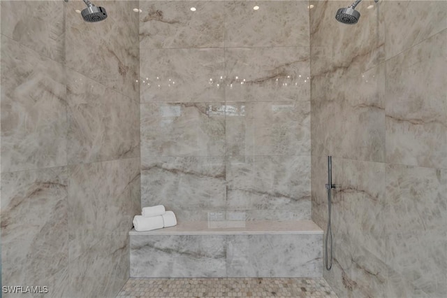 bathroom with a tile shower