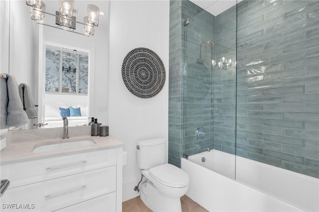 full bathroom featuring vanity, tiled shower / bath combo, and toilet