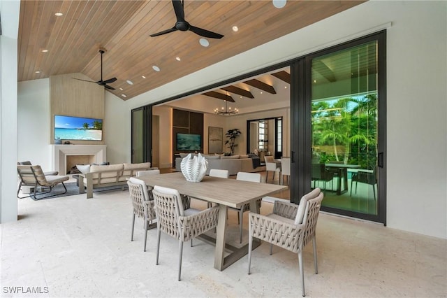 view of patio / terrace featuring an outdoor living space with a fireplace and ceiling fan