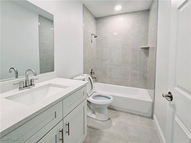 full bathroom featuring toilet, vanity, and tiled shower / bath