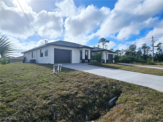 ranch-style home featuring central AC, a garage, and a front lawn