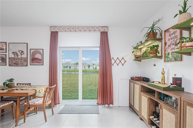 doorway featuring light tile patterned floors