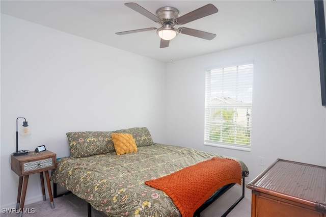 bedroom featuring ceiling fan and carpet floors