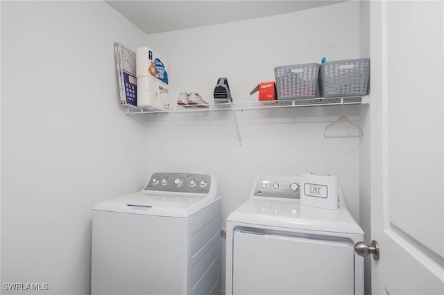 clothes washing area featuring washing machine and dryer