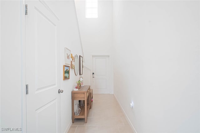 corridor with light tile patterned flooring