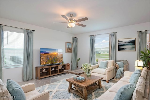 living room with light tile patterned floors and ceiling fan