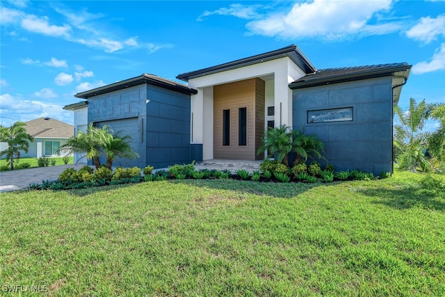 contemporary house with a front yard