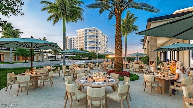 patio terrace at dusk with outdoor dining space