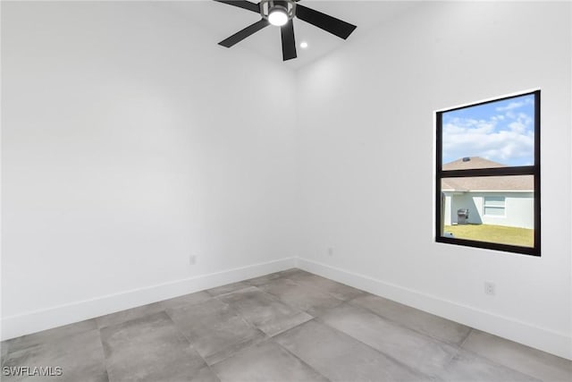 spare room featuring ceiling fan, recessed lighting, and baseboards