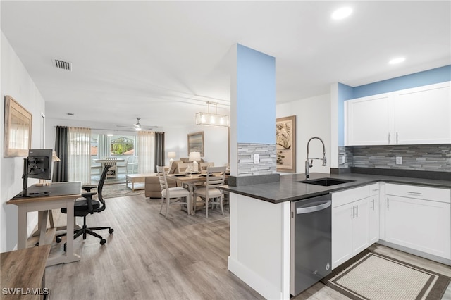 kitchen featuring white cabinetry, dishwasher, ceiling fan, sink, and kitchen peninsula