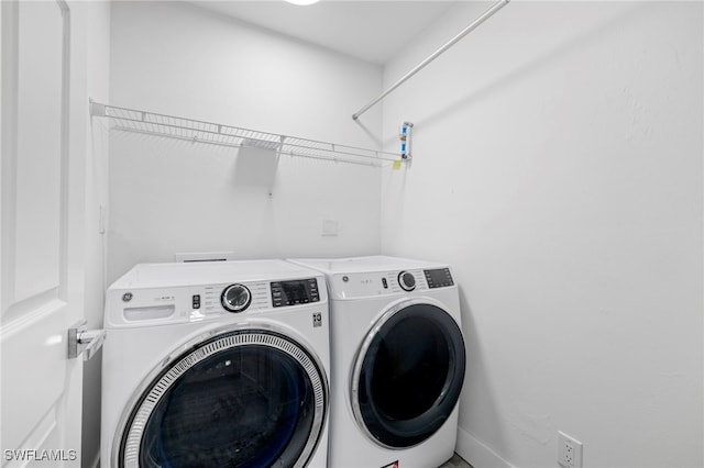 laundry area featuring washer and clothes dryer