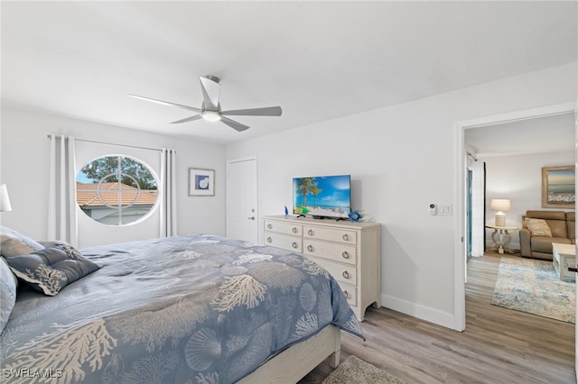 bedroom featuring ceiling fan and hardwood / wood-style flooring